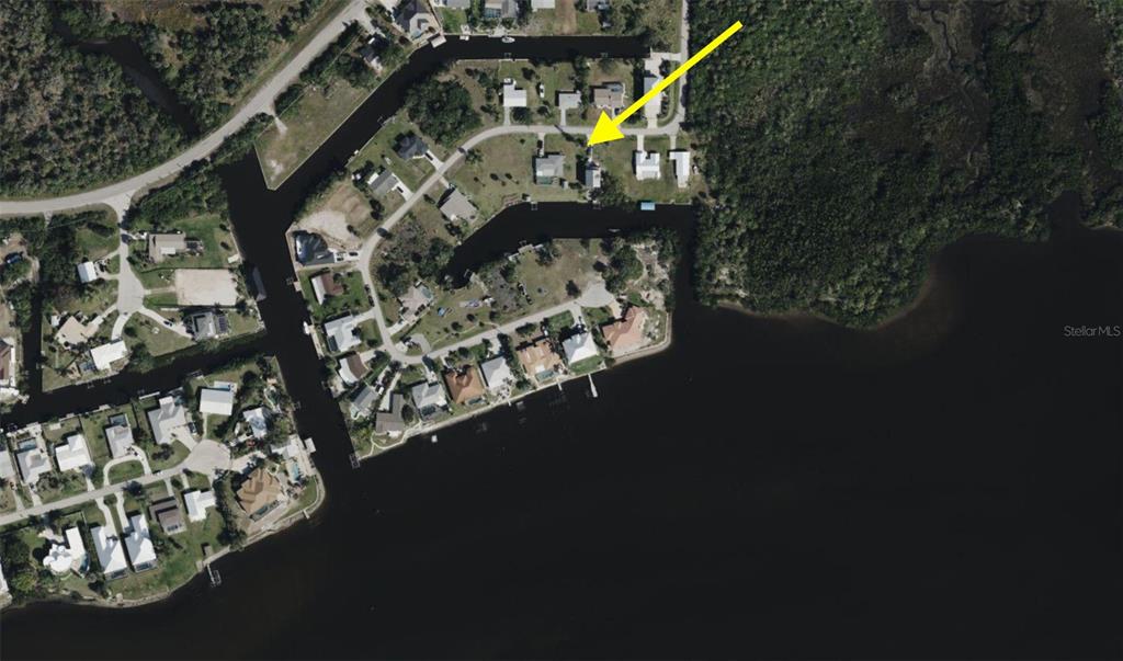 This is an aerial map view of a residential waterfront property with a canal — 155 DANFORTH DR, PUNTA GORDA, FL