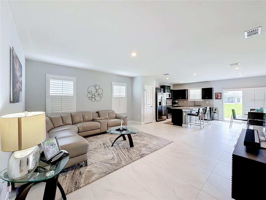 This is a floor plan of a single-story home with a garage and two bedrooms — 3628 SAPPHIRE HOLLOW WAY, FORT PIERCE, FL