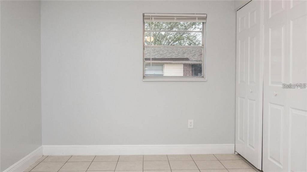 9416 GREYSTONE ROAD UNIT A, THONOTOSASSA, FL — photo 4 of 5