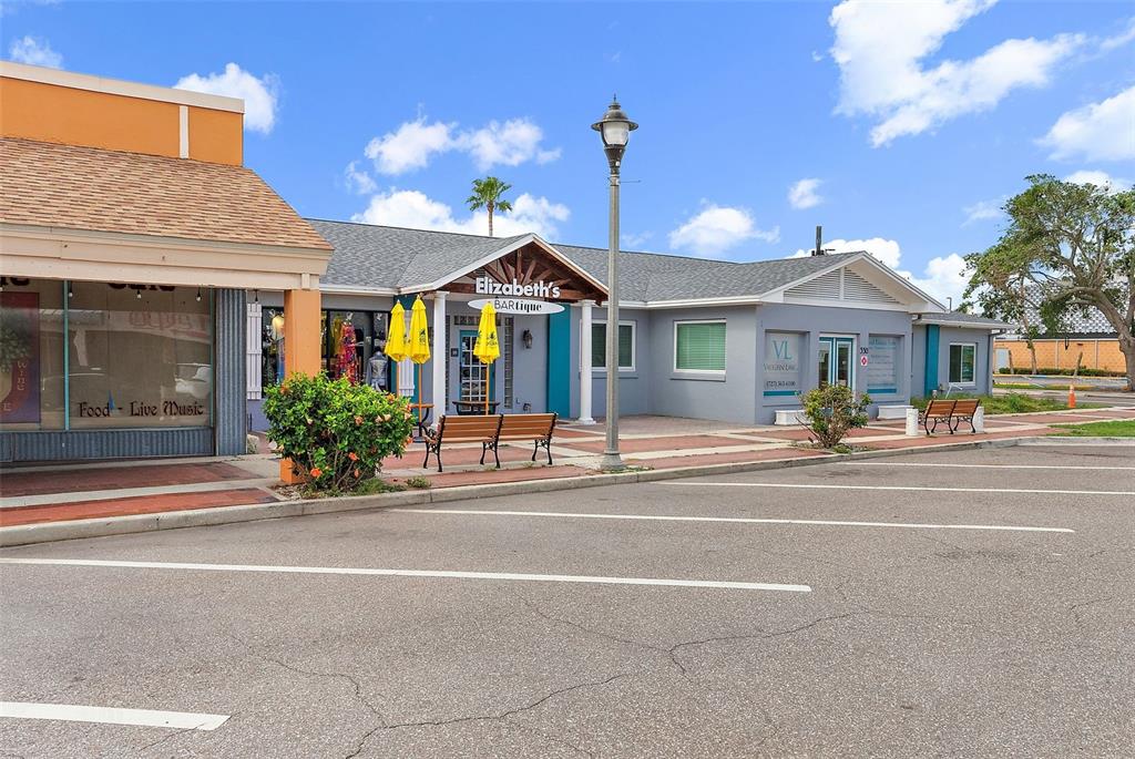 A commercial building exterior features a storefront named Elizabeth's BARtique with a parking lot — 350 COREY AVENUE, ST PETE BEACH, FL