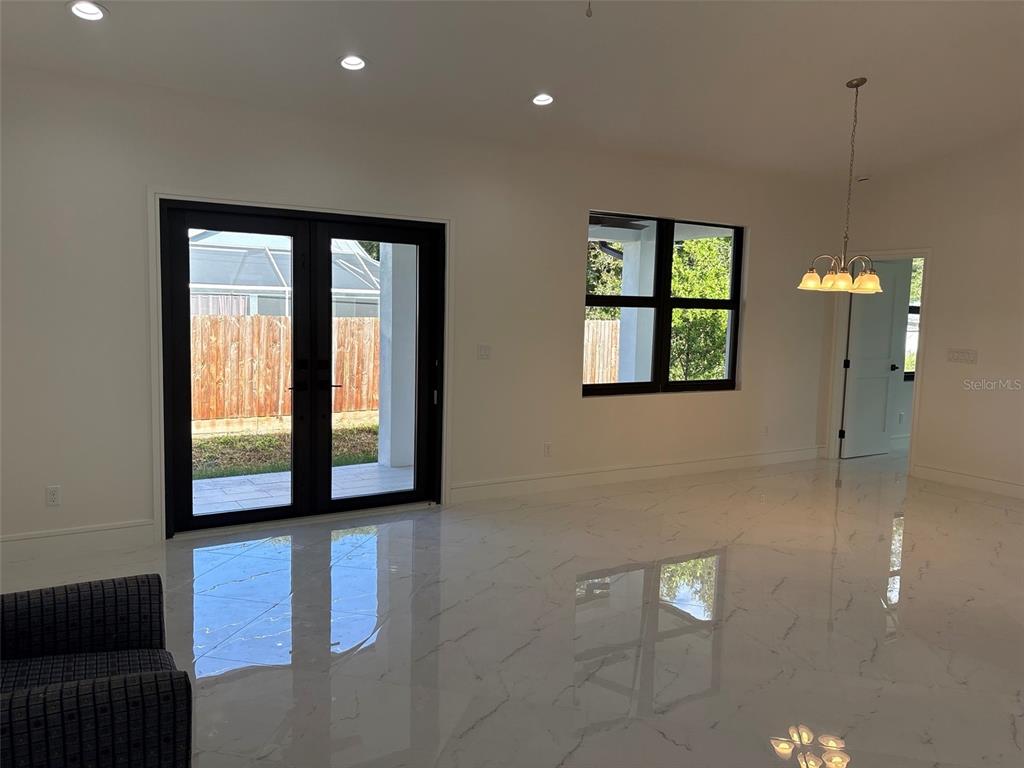 A single-story house with a white exterior, brown trim, and an attached two-car garage — 2356 30TH AVENUE SW, VERO BEACH, FL