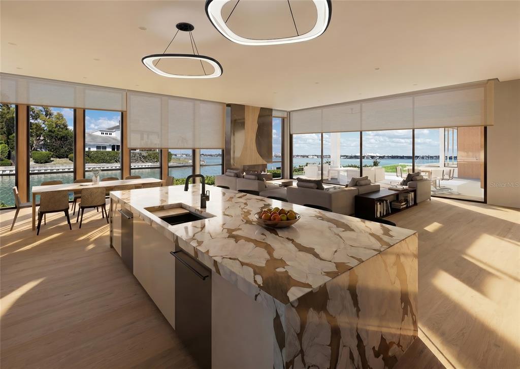 This modern kitchen features a large marble island, light wood floors, and floor-to-ceiling windows — 600 MOURNING DOVE DRIVE, SARASOTA, FL