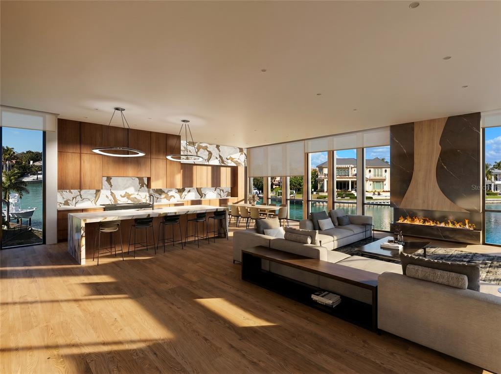 This rendering shows an open-concept living area with a modern kitchen, fireplace, and waterfront views — 600 MOURNING DOVE DRIVE, SARASOTA, FL