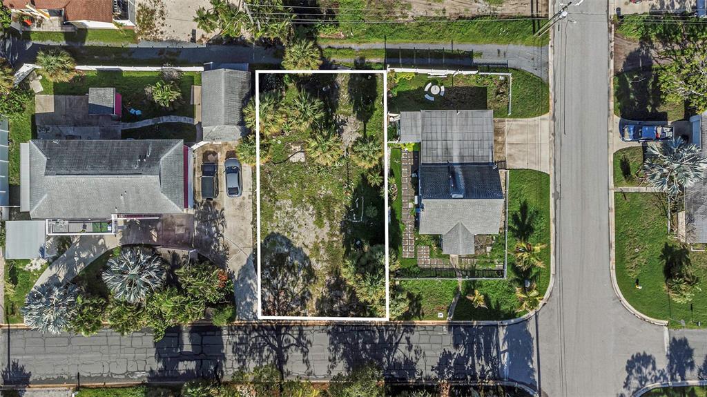 An aerial view shows a vacant rectangular residential lot situated between two existing houses — 3107 CLINTON STREET S, GULFPORT, FL