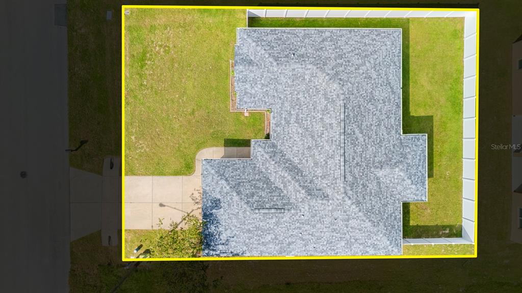 An aerial view shows a house with a gray shingled roof and a fenced backyard — 611 W WALKERTOWN DRIVE, CITRUS SPRINGS, FL