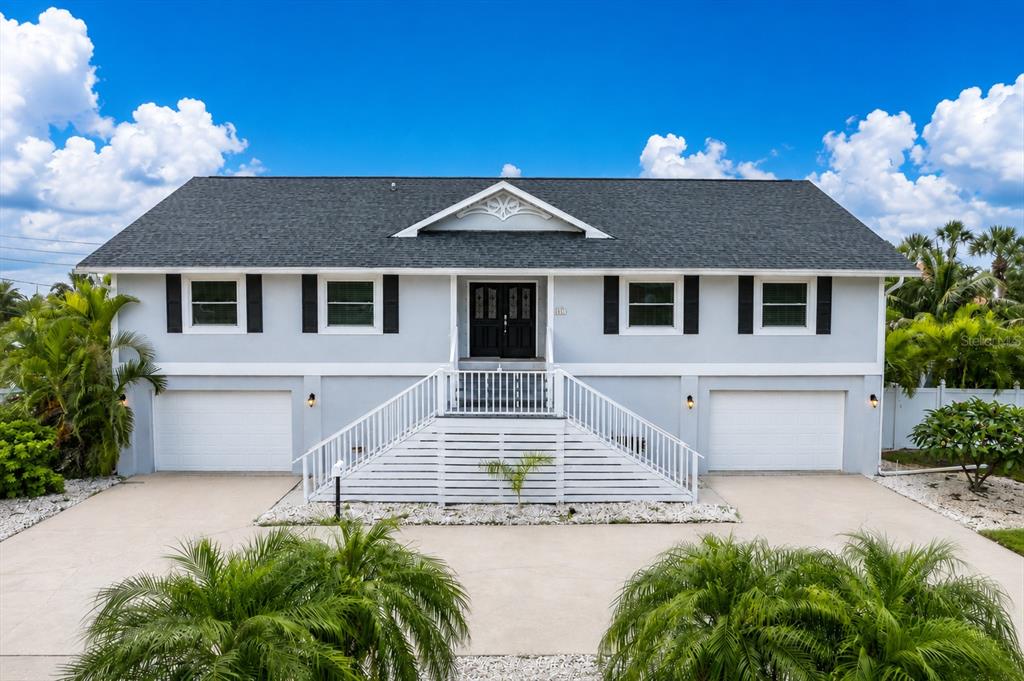 An aerial view shows a residential house with a red location pin near a golf course — 6501 MOCKINGBIRD WAY S, GULFPORT, FL