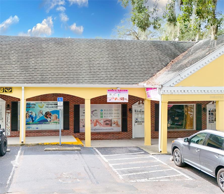 The exterior of a commercial building features a nail salon and a diagnostics office — 110 LITHIA PINECREST ROAD UNIT D, BRANDON, FL