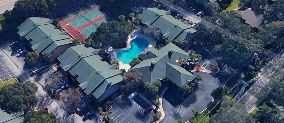 An aerial view shows a residential complex with a swimming pool and tennis courts — 305 WYMORE ROAD UNIT # 107, ALTAMONTE SPRINGS, FL