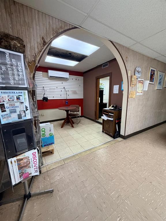 An office interior features a tiled floor, an arched entryway, and a small seating area — 617 AVE. ANDALUCIA, SAN JUAN, PR