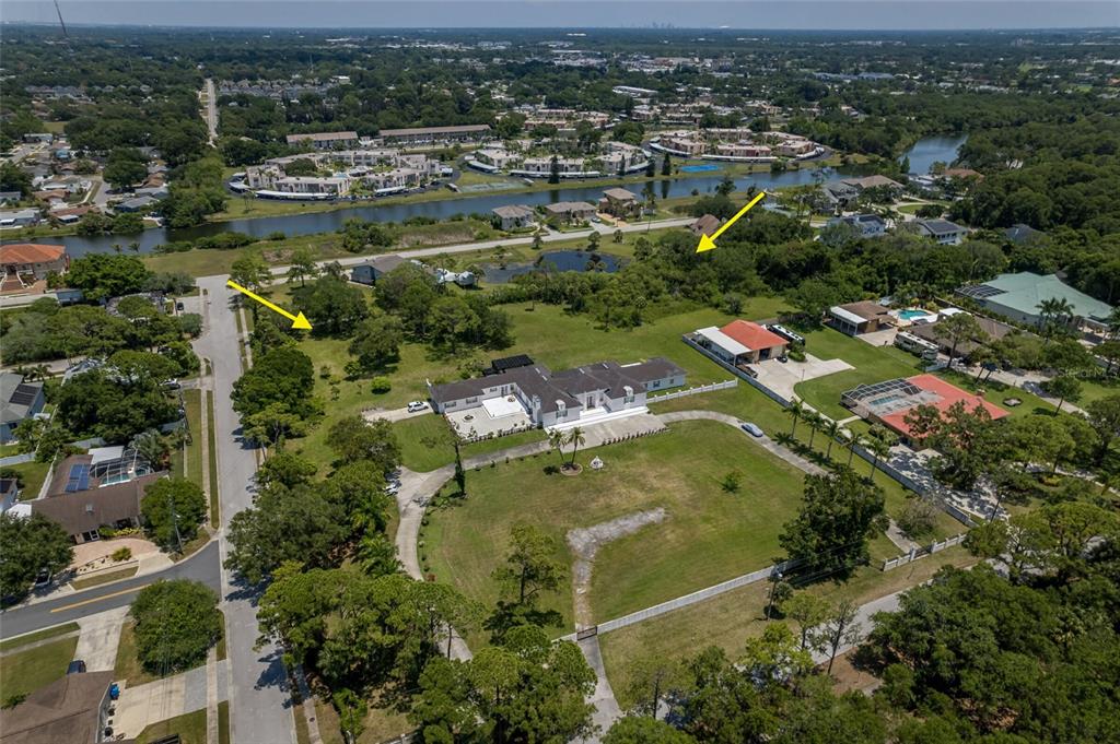 An aerial view shows a large house with a circular driveway and surrounding green space — 8181 98TH STREET, SEMINOLE, FL