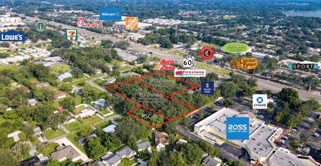 An aerial view shows a wooded lot outlined in red near a commercial shopping area — 205 MORNINGSIDE LOOP, VALRICO, FL