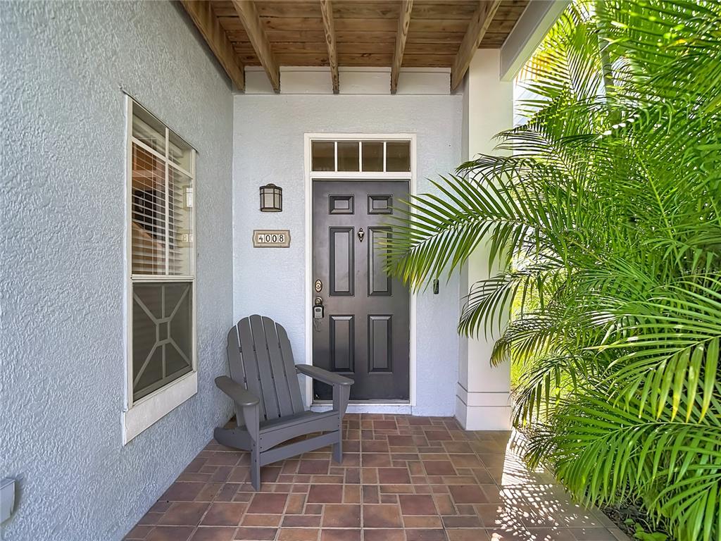 This is a two-story floor plan showing a living area, kitchen, and four bedrooms — 4008 BANGALOW PALM COURT, TAMPA, FL