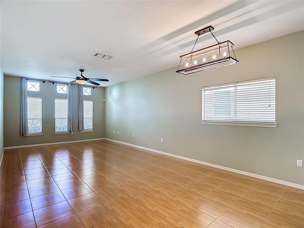 An entryway features a white front door with a transom window and a closet door — 4008 BANGALOW PALM COURT, TAMPA, FL