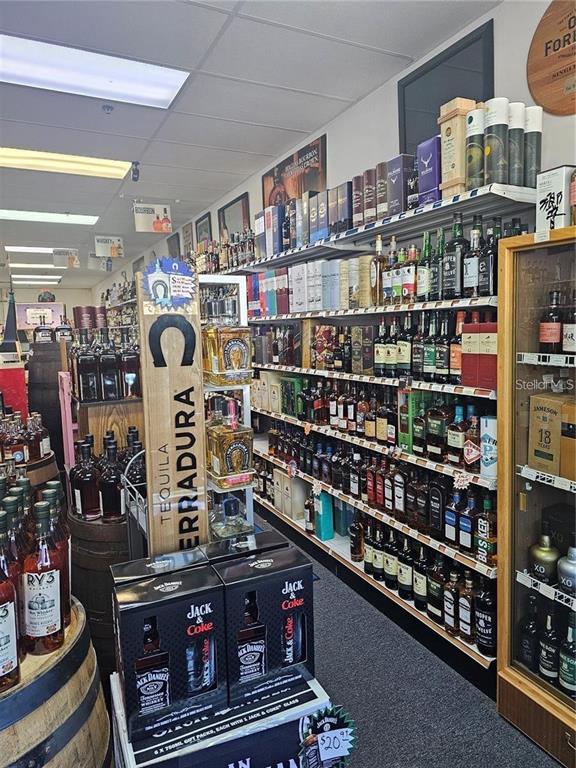 Shelves in a retail store are stocked with various bottles of liquor and spirits — # CONFIDENTIAL, OVIEDO, FL
