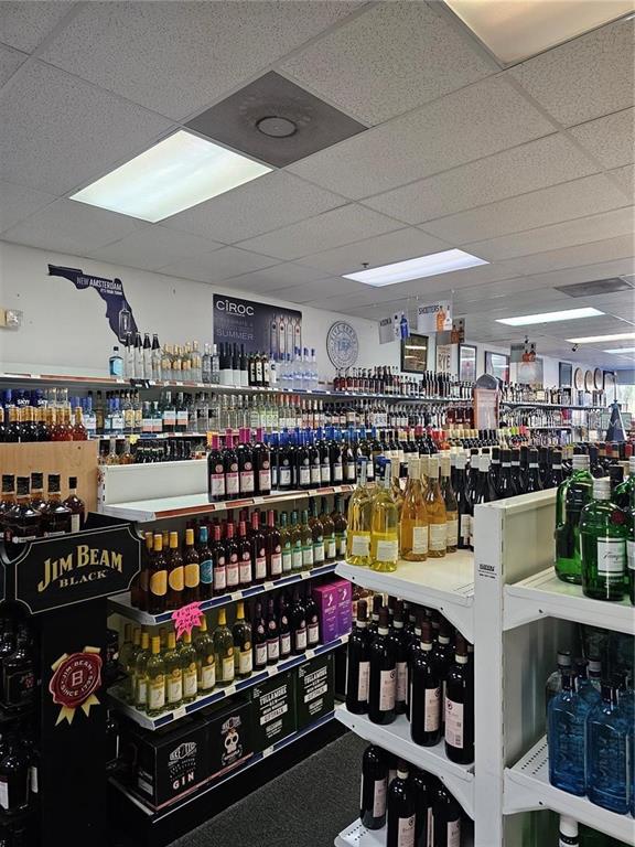 This liquor store features rows of shelves stocked with various bottles of wine and spirits — # CONFIDENTIAL, OVIEDO, FL