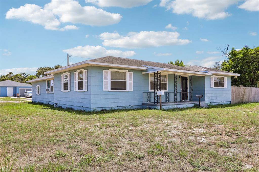 A light blue single-story house with white shutters and a covered front porch — 4500 3RD AVENUE S, ST PETERSBURG, FL