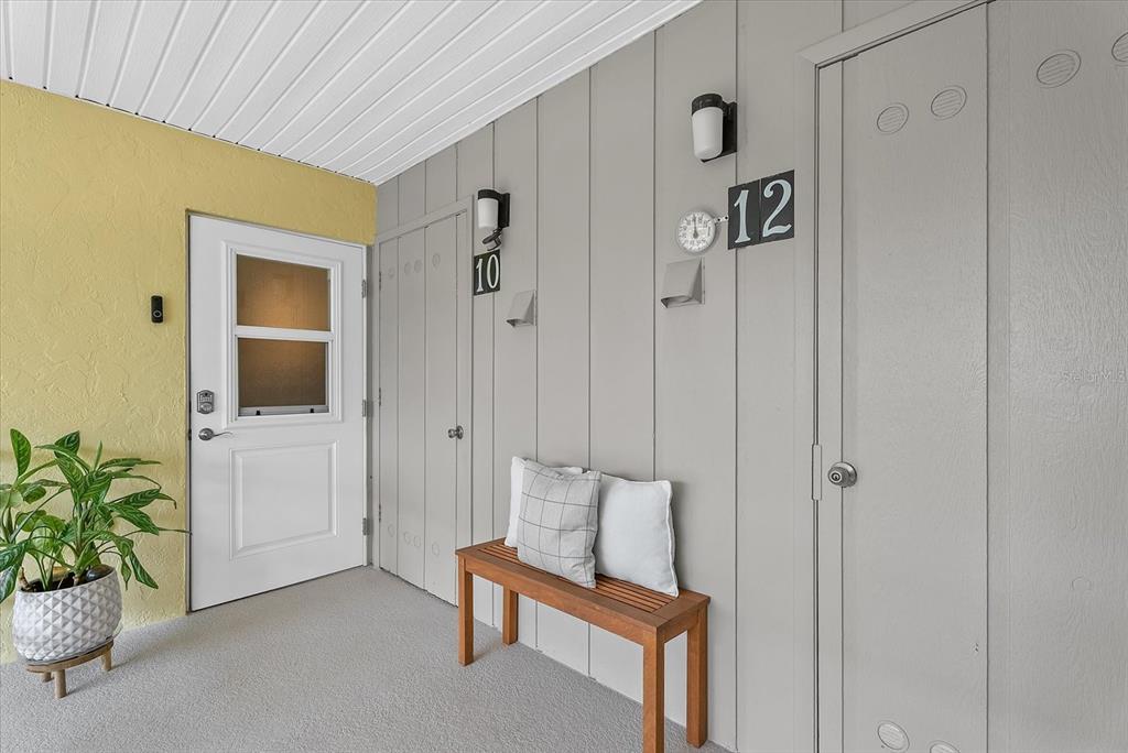 This is a floor plan showing a two-bedroom home with two porches and two bathrooms — 101 LOUELLA LANE UNIT 10, NOKOMIS, FL