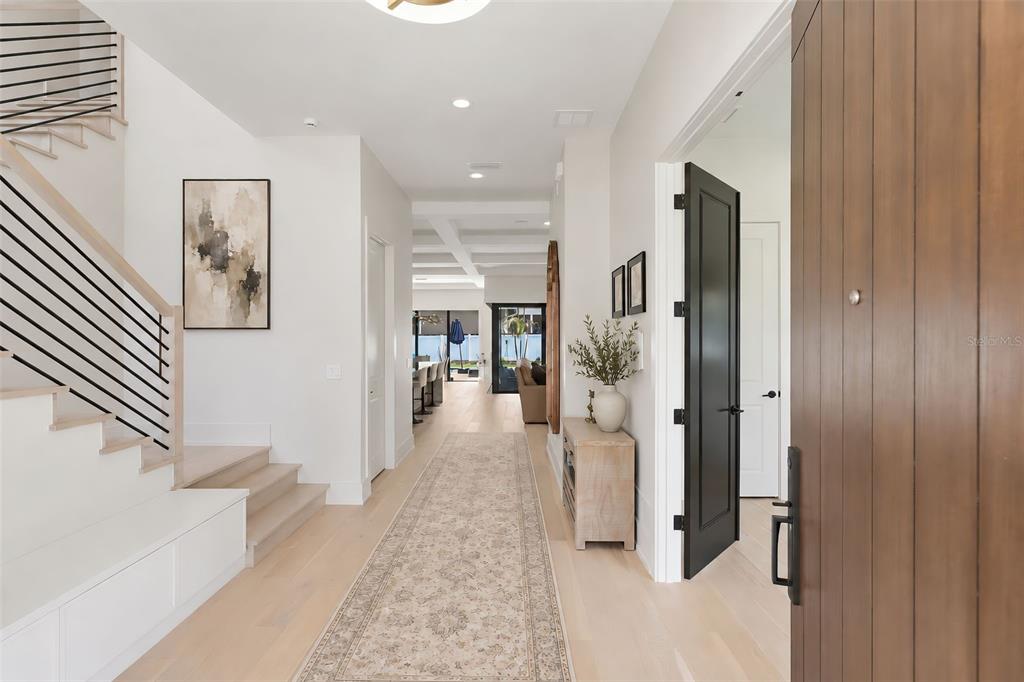 A modern two-story house with white stucco, a dark garage, and a palm tree — 809 E CHURCH STREET, ORLANDO, FL