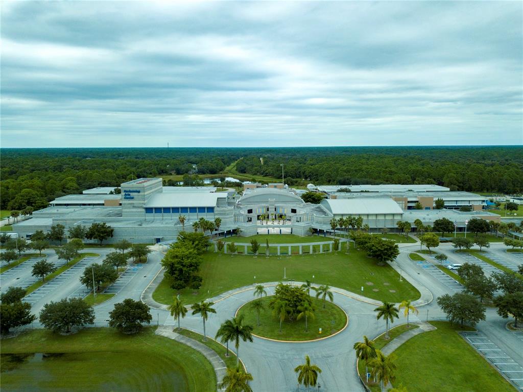An aerial view of a large school building with a central courtyard and parking lots — NOPPENBERG AVENUE, NORTH PORT, FL