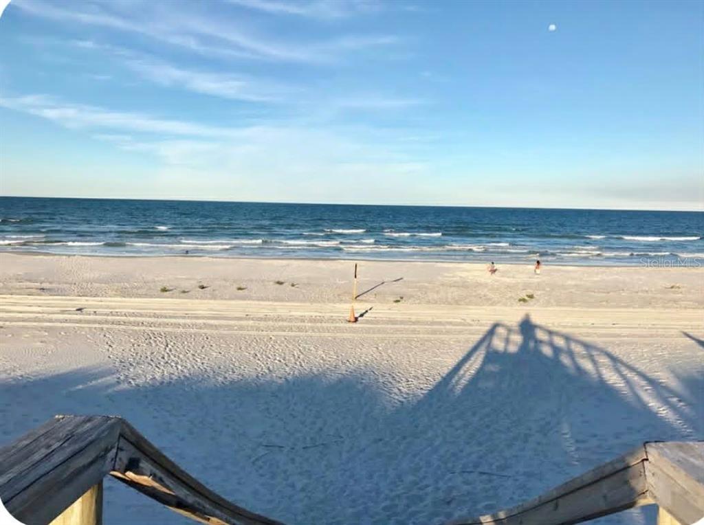 A view of a sandy beach and the ocean from a wooden staircase — 6300 S A1A BOULEVARD UNIT A93U, ST AUGUSTINE, FL