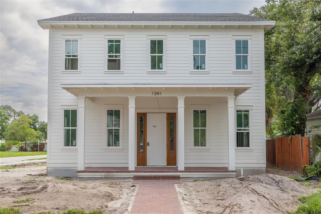 A two-story house under construction with orange ZIP System sheathing and a front porch — 1341 28TH AVENUE N, ST PETERSBURG, FL