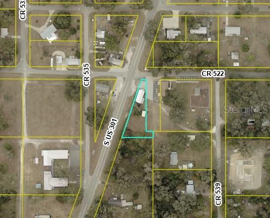 This is an aerial map showing a property boundary highlighted in light blue — 821 S US 301, SUMTERVILLE, FL