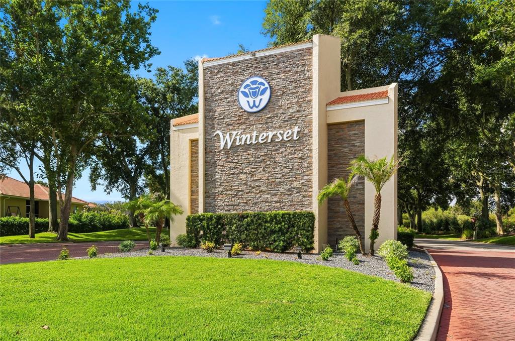 A stone monument sign for Winterset stands at the entrance of a residential community — 701 MAGNOLIA PLACE, WINTER HAVEN, FL