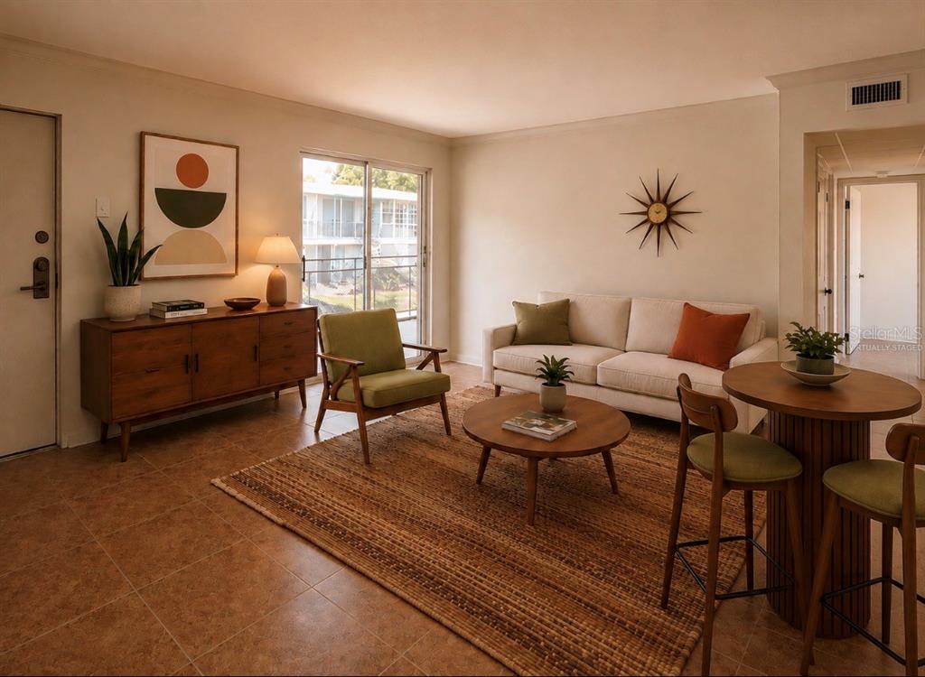 This is a virtually staged living room with tile floors, a sofa, and a dining area — 151 N ORLANDO AVENUE UNIT 242, WINTER PARK, FL