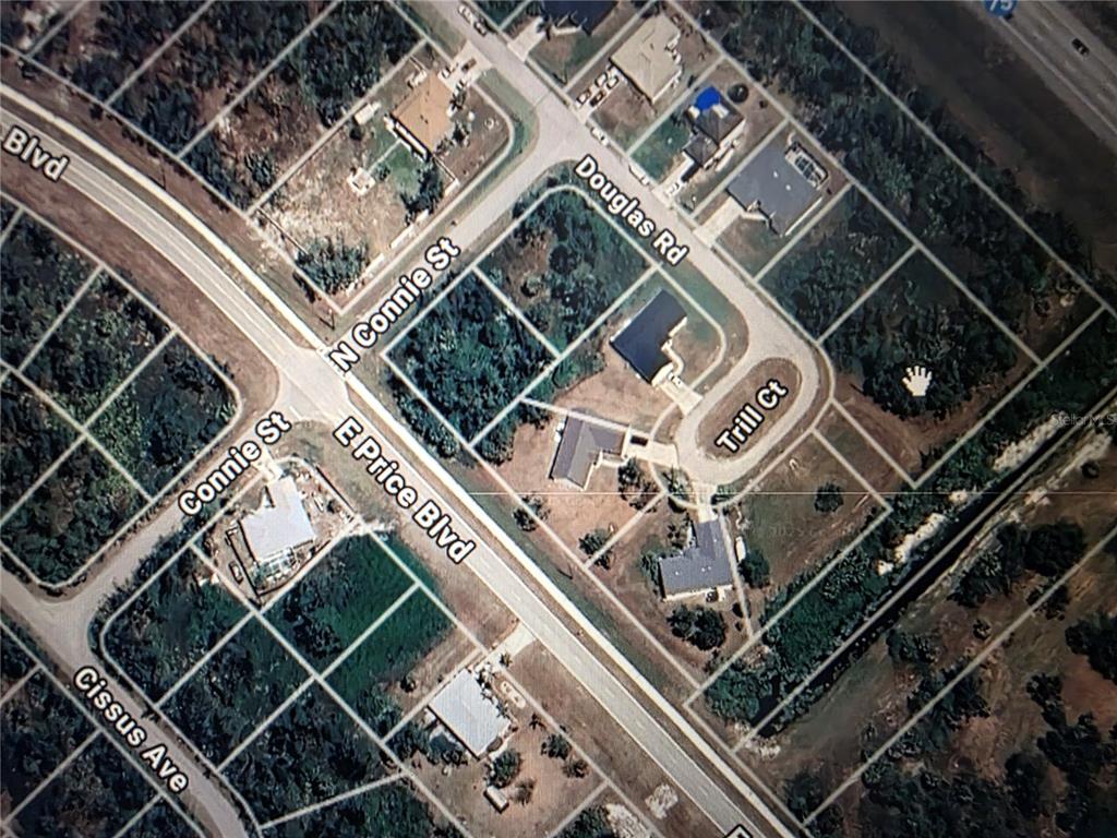 This is an aerial map view of a residential neighborhood with streets and housing lots — DOUGLAS ROAD, NORTH PORT, FL