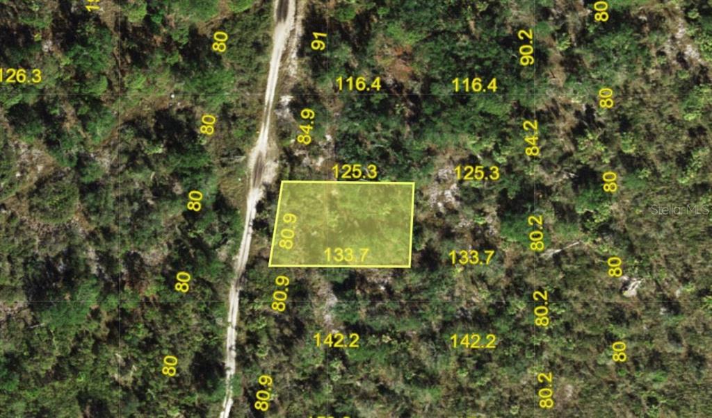 This is an aerial map showing a highlighted rectangular plot of land — 730 SUNSET BOULEVARD E, PUNTA GORDA, FL