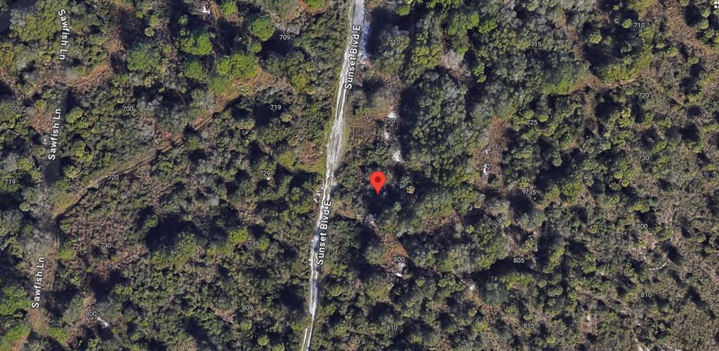 This is a satellite map view showing a wooded lot located along Sunset Blvd E — 730 SUNSET BOULEVARD E, PUNTA GORDA, FL