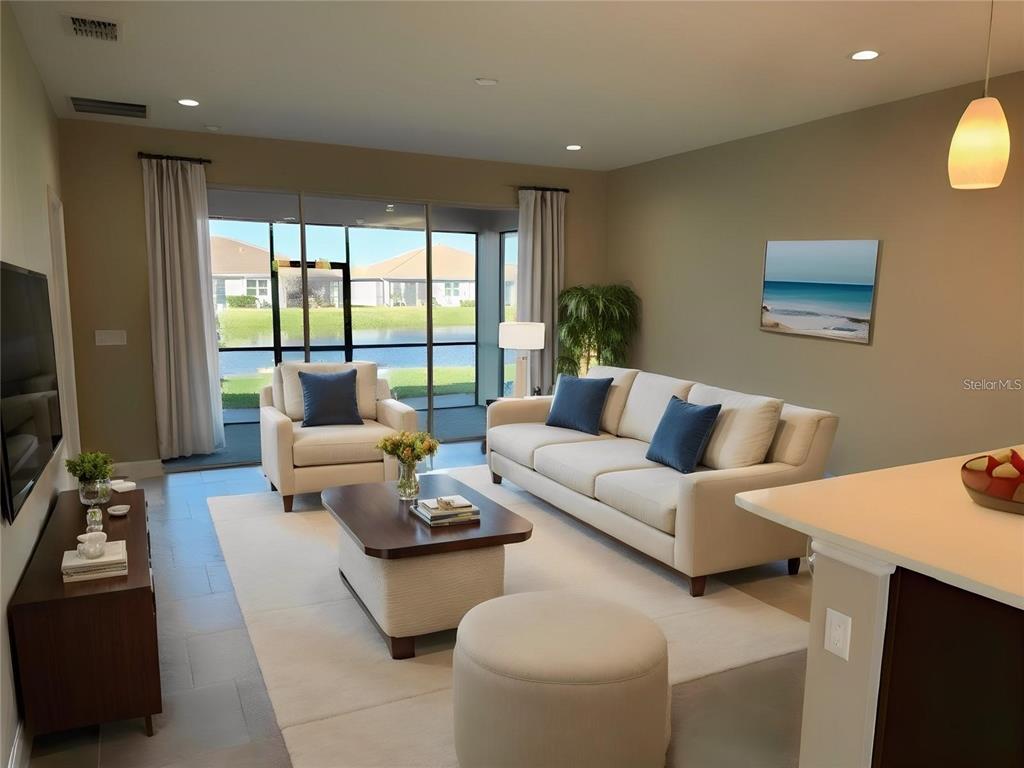 A living room features a beige sofa, armchair, coffee table, and sliding doors overlooking a lake — 4950 SIENNA ISLES AVENUE, WIMAUMA, FL
