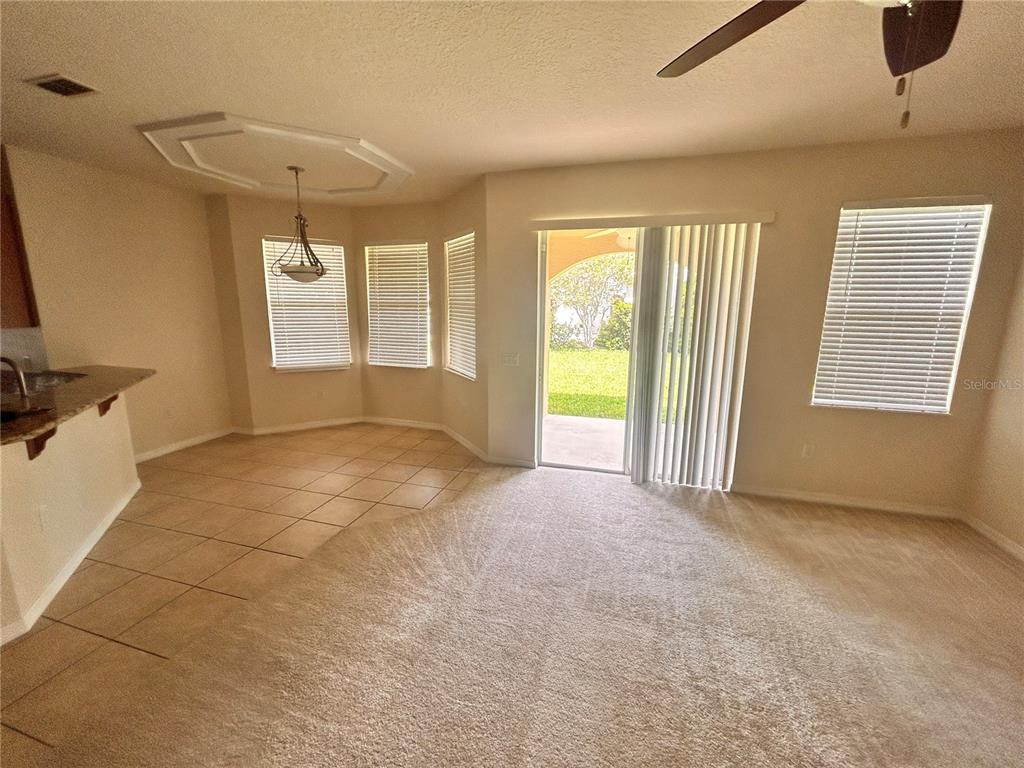 A view of a two-story foyer with a staircase, white railings, and a loft landing — 1125 LASCALA DRIVE, WINDERMERE, FL