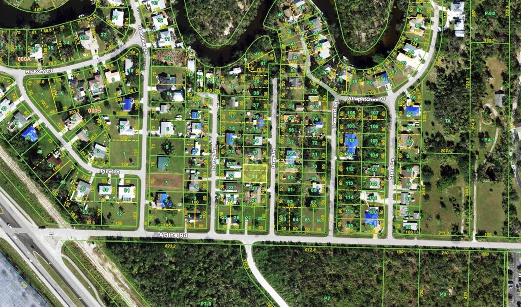 This is an aerial map showing a residential neighborhood with streets and property lot lines — 5905 GREY LANE, PUNTA GORDA, FL