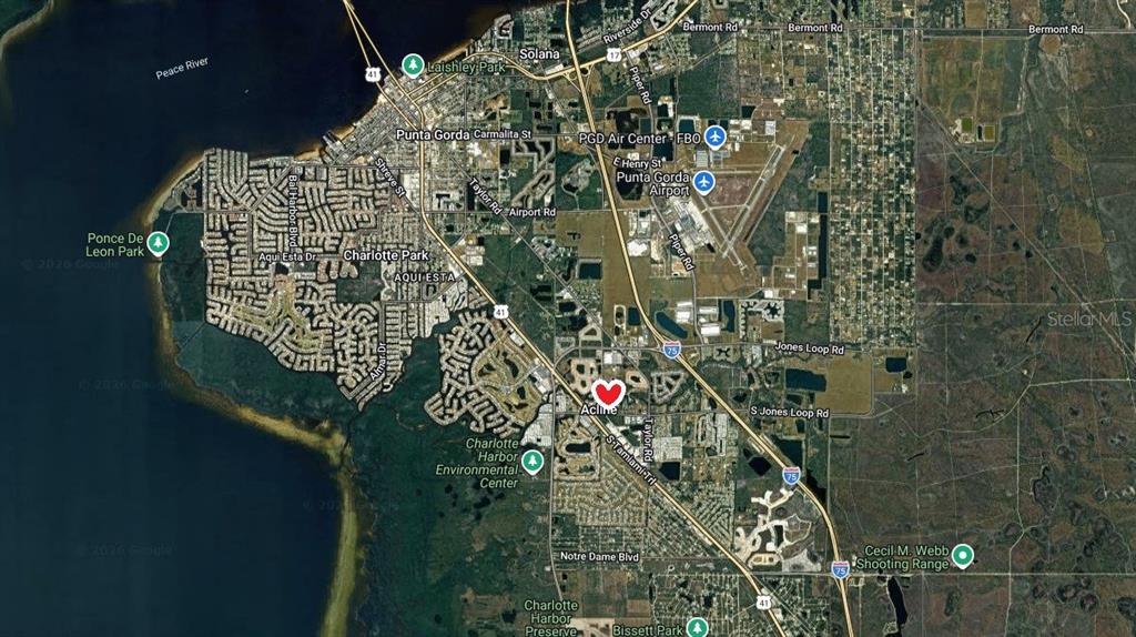 This is a satellite map showing the Punta Gorda area with a heart icon marker — 5905 GREY LANE, PUNTA GORDA, FL