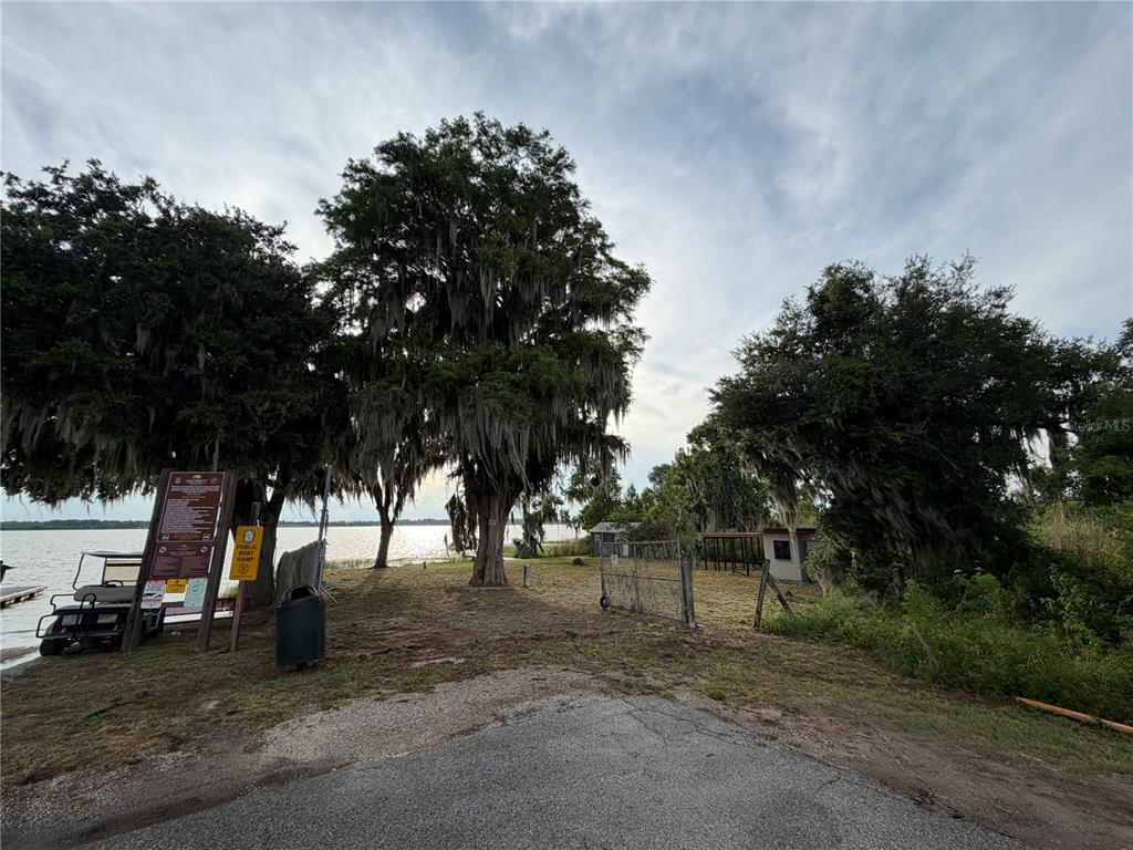 A public boat ramp area features large trees with Spanish moss overlooking a lake — 12703 CR-48, ASTATULA, FL
