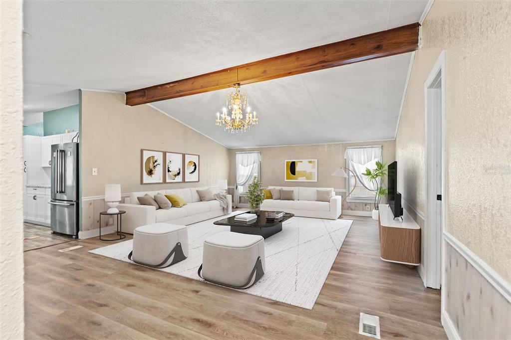 A light yellow manufactured home with a front porch sits on a large gravel lot — 7876 RIDGE ROAD, WEEKI WACHEE, FL