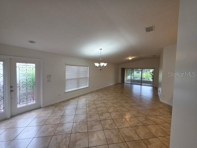 A laundry room features a white washer and dryer, a utility sink, and wire shelving — 12120 TRIPLETAIL LANE, ORLANDO, FL