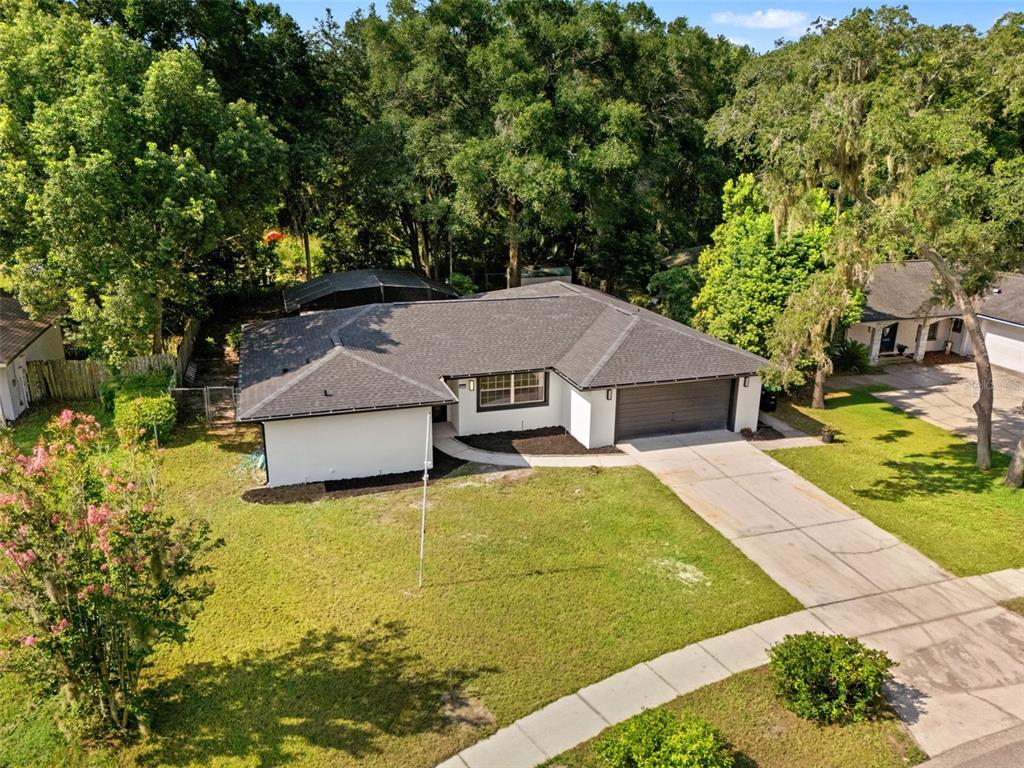 An aerial view of a single-story house with a white exterior and a dark roof — 436 BISON CIRCLE, APOPKA, FL