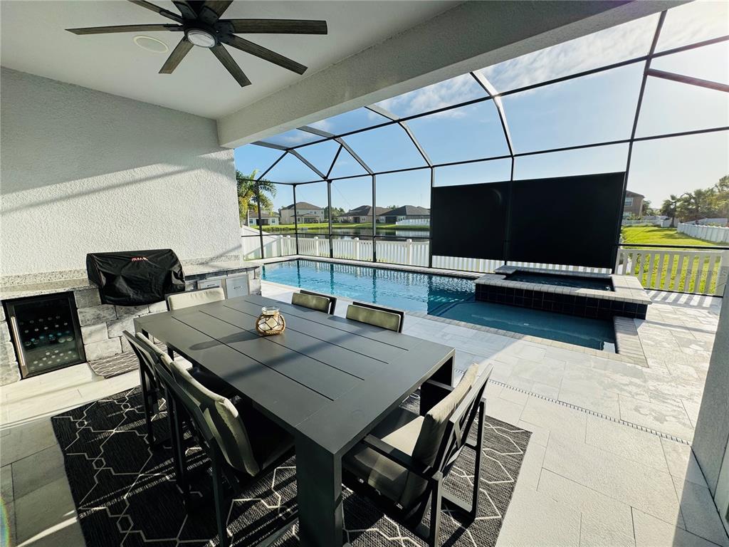 A single-story house with a three-car garage, stone accents, and a paved driveway — 11614 SUNBURST MARBLE ROAD, RIVERVIEW, FL