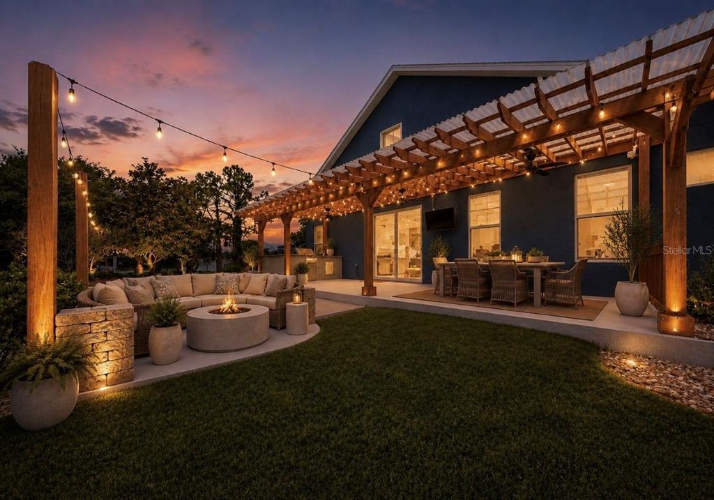 A backyard patio features a pergola, fire pit, outdoor seating, and string lights at sunset — 13101 DONE GROVEN DRIVE, DOVER, FL