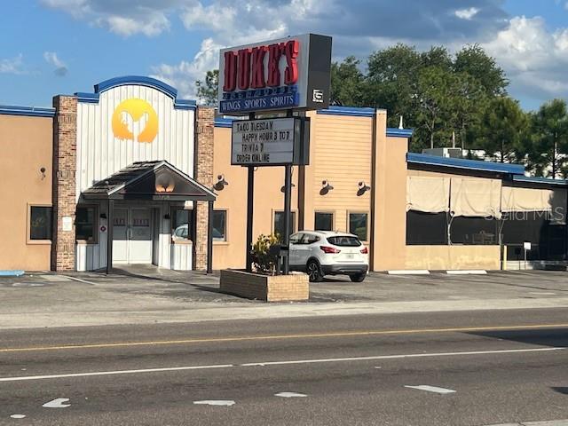 A commercial building with a Duke's sign and a white SUV parked in front — 1708 6TH STREET SE, WINTER HAVEN, FL