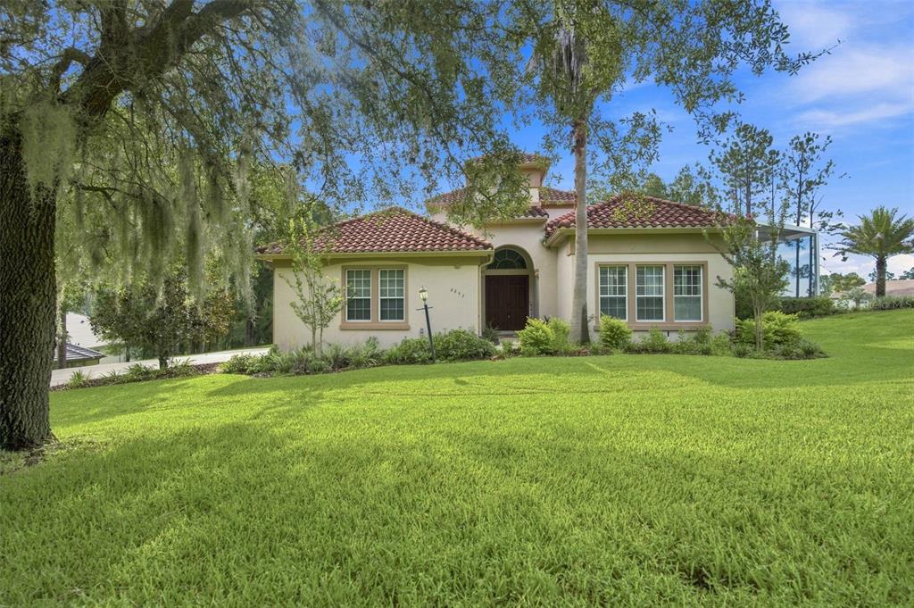 A single-story house with a red tile roof and a large front lawn — 2257 N HICKORY GLEN POINT, HERNANDO, FL