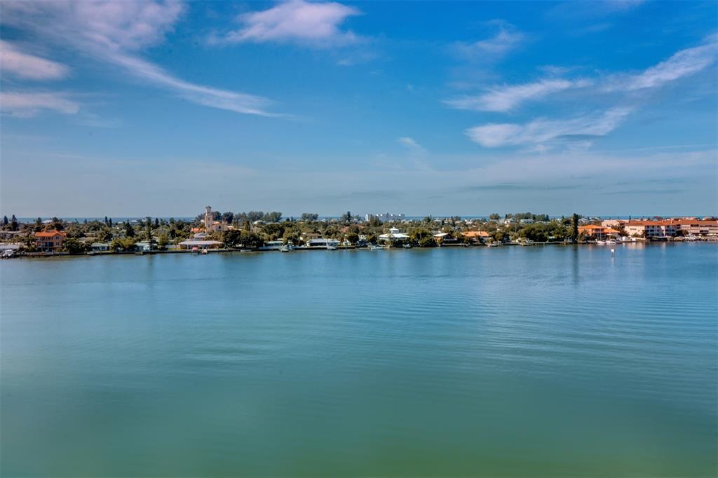 An aerial view of a calm body of water with a coastal town in the background — 7974 SAILBOAT KEY BOULEVARD S UNIT 408, SOUTH PASADENA, FL