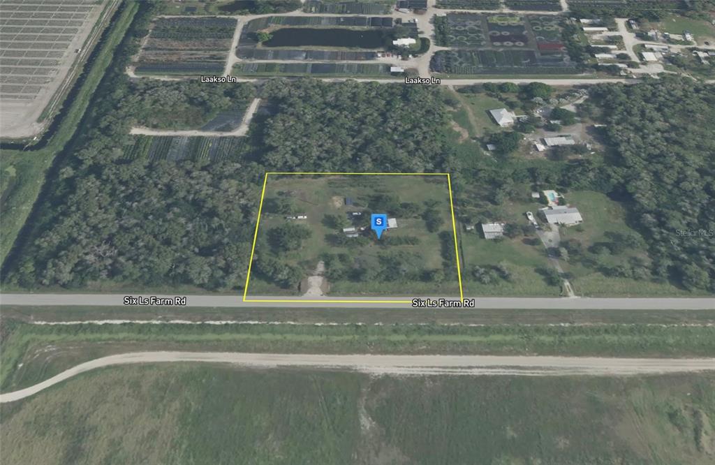 An aerial view shows a rectangular property lot outlined in yellow along a paved road — 11072 SIX LS FARM ROAD, NAPLES, FL