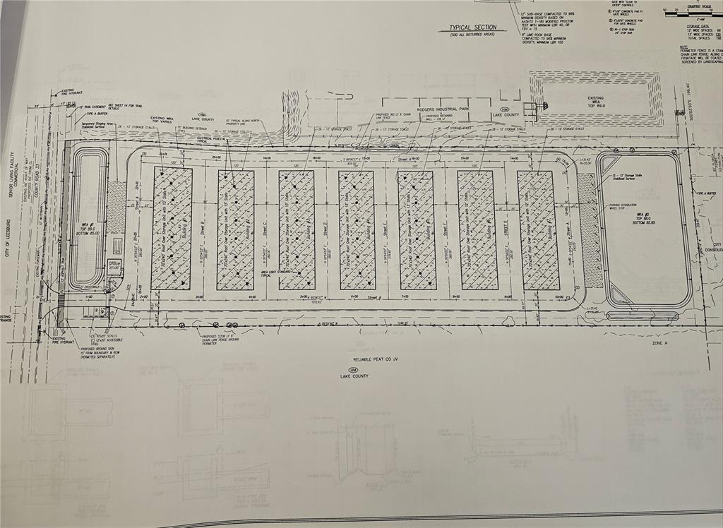This is a site plan rendering for a commercial storage facility with multiple buildings — 26630 COUNTY ROAD 33, OKAHUMPKA, FL
