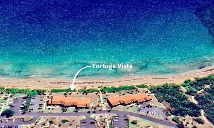 An aerial view shows two buildings labeled Tortuga Vista located directly on a sandy beach — DR BEACH VILLAGE UNIT 148, HUMACAO, PR