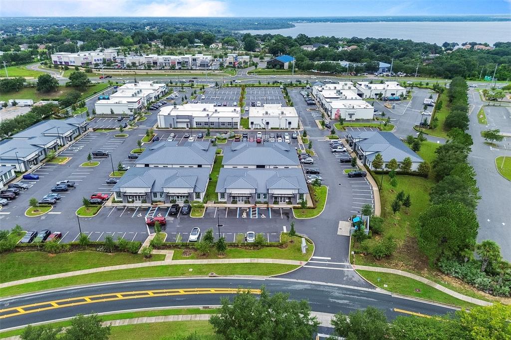 An aerial view of a commercial office park with multiple buildings and parking lots — 2623 S US HIGHWAY 27, CLERMONT, FL