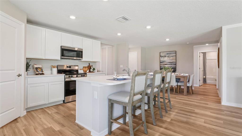 8786 TRIUMPH CIRCLE, WILDWOOD, FL — photo 4 of 30