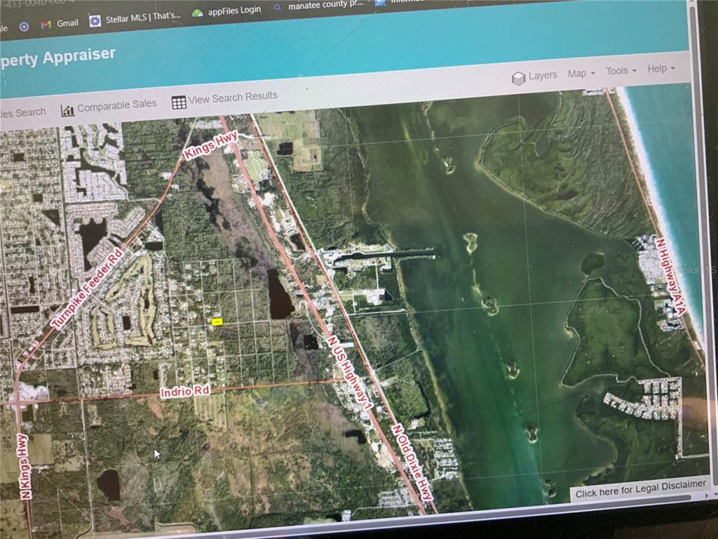 This is a map showing a coastal area with roads, vegetation, and water bodies — SNAIL KITE LANE, FORT PIERCE, FL